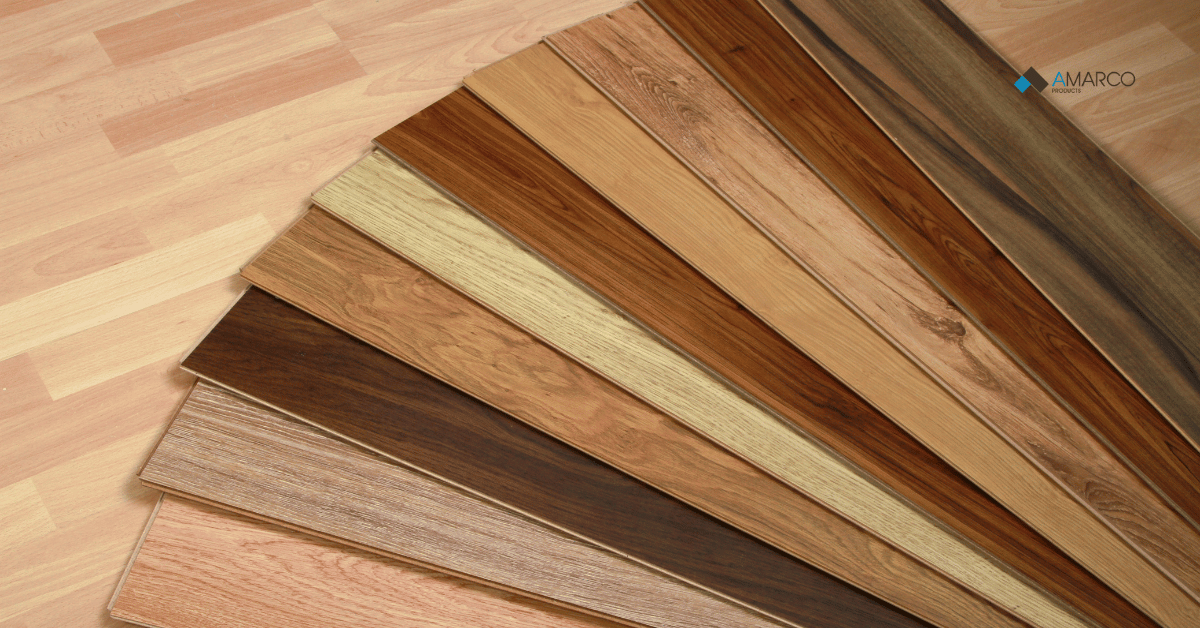 A fan sample array displaying various wood-look vinyl planks suitable for durable commercial kitchen flooring.